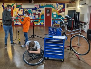 Young people fixing bikes at Pie Factory Music HQ